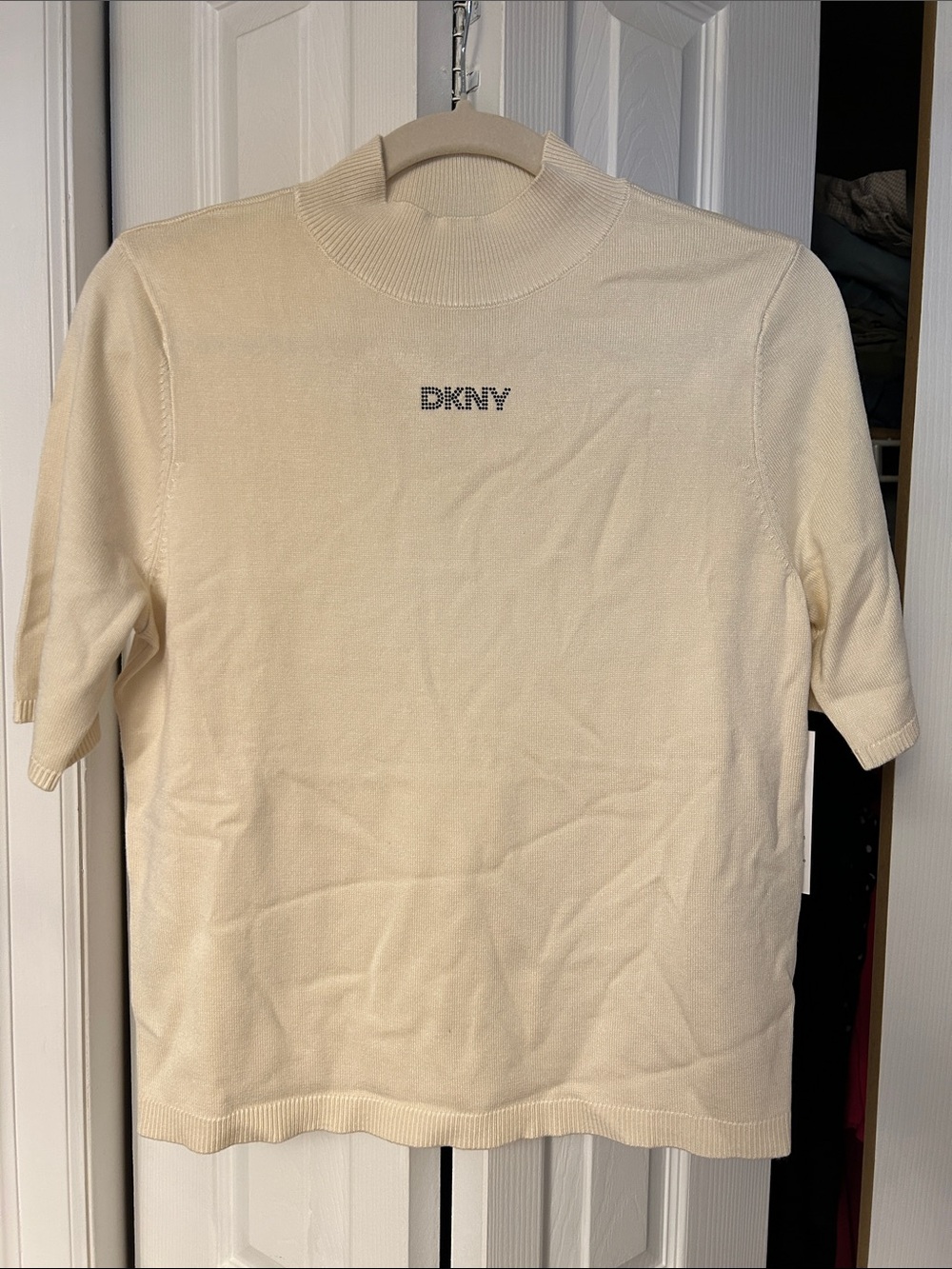DKNY Eggnog Short Sleeve Mock Neck Knit Top with Crystal Logo Accent